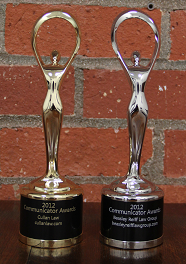 Two Communicator Awards statues