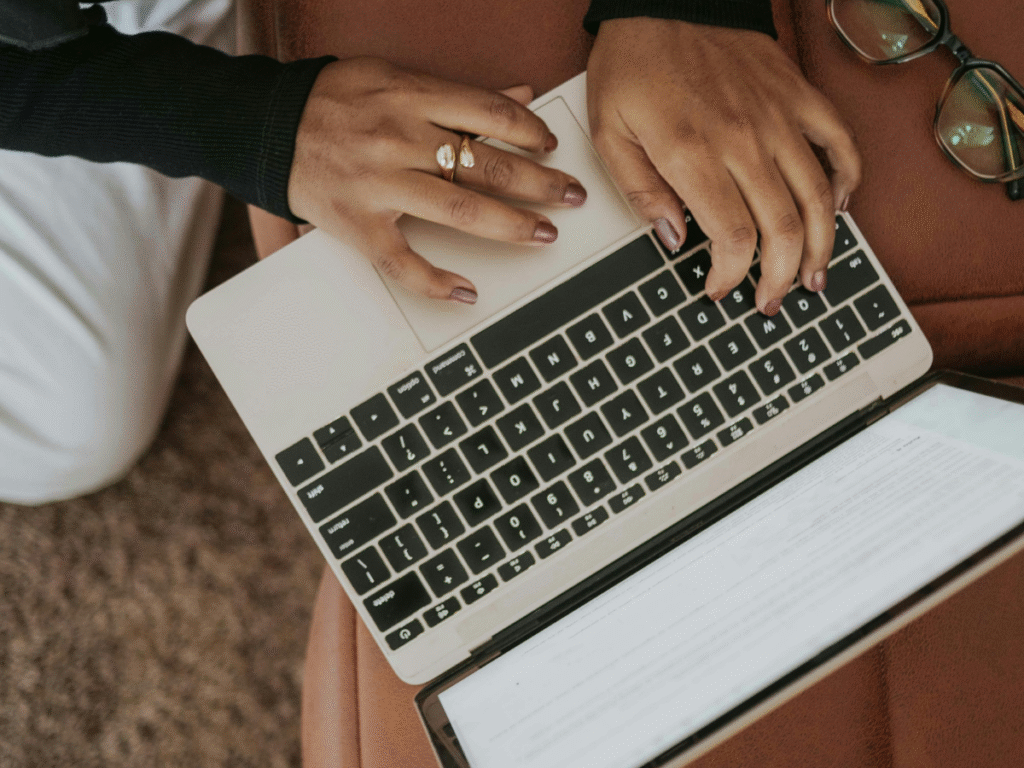 Person using a laptop with a tablet nearby representing chunking content strategies, answer engine optimization AEO, generative engine optimization GEO, and SEO to improve law firm online visibility.