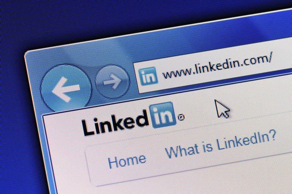Linkedin homepage is displayed in web browser on a computer screen. Linkedin.com is a business-oriented social networking site."