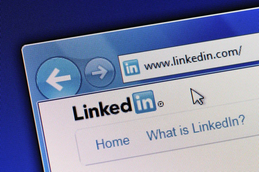 Linkedin homepage is displayed in web browser on a computer screen. Linkedin.com is a business-oriented social networking site."