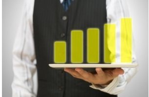waiter holding tablet displaying a bar graph
