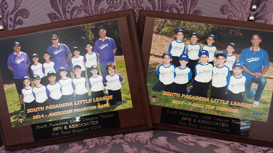 Placards with images of softball players sponsored by SLS